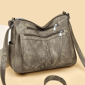 Retro-Umhängetasche aus gewaschenem Leder mit mehreren Fächern und Webdetails