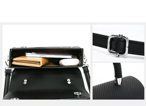 Detail view of black textured box bag showing interior capacity and silver hardware buckles