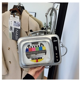 Detail of silver vintage TV shaped handbag featuring colorful screen and metallic chain