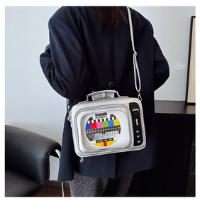 Detail of silver TV-shaped crossbody bag featuring retro signal screen and heart buckle