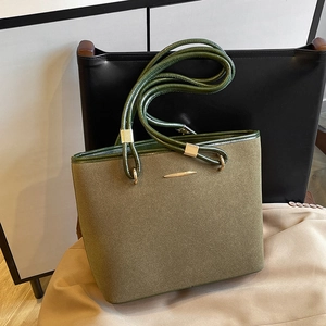 Vintage dark green suede tote bag with leather handles and gold metal details