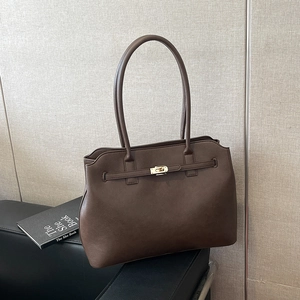 Classic dark brown leather tote bag with metal twist lock and shoulder straps