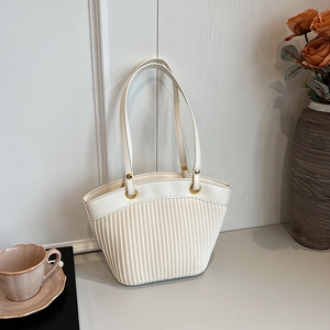 Elegant white pleated tote bag with golden rings and slim leather straps for women