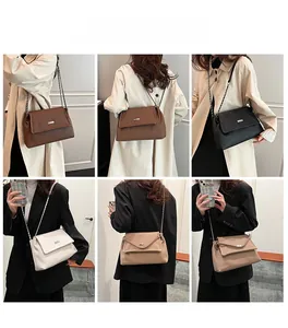 Detail view of stylish pleated shoulder bag with chain strap in four classic colors