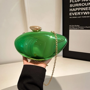Emerald green mirror evening clutch bag with gold stone clasp and chain strap
