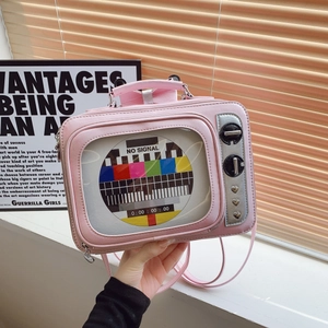 Pink retro TV shaped handbag with transparent window and colorful no-signal pattern