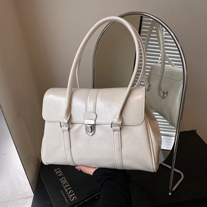 Chic cream white leather shoulder bag with silver buckle and dual straps for women