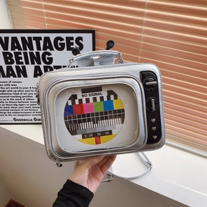 Creative silver vintage TV-shaped handbag with clear window and metal stud details