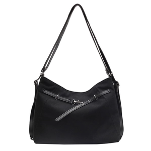 Minimalist large black canvas tote bag with leather trim and silver metal buckle details