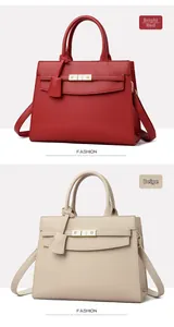 Detail of red and beige textured leather handbags with iconic gold metal clasp closure