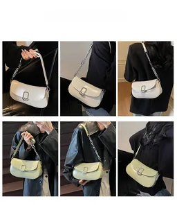 Chic soft leather shoulder bag with metal lock shown in cream and light green colors