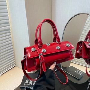 Fashionable red patent leather motorcycle bag with silver studs and adjustable strap