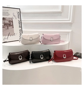 Group display of chic patent leather crossbody bags in five colors on a white pedestal