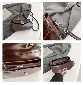 Detailed interior of dark brown patent leather shoulder bag showing the zip compartment