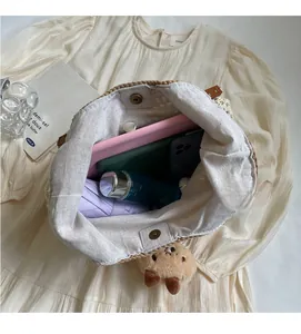 Detail of the woven bucket bag interior showing spacious capacity for everyday essentials