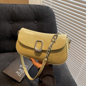 Chic pale yellow soft leather shoulder bag with silver chain and metal buckle detail