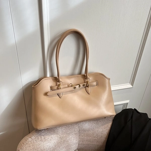 Elegant apricot leather shell tote bag with gold ring buckle and long dual handles