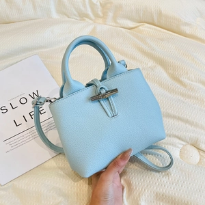 Retro light blue leather bucket bag with bamboo metal buckle and top handles