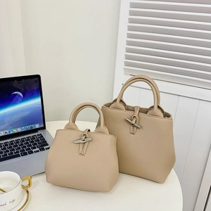 Beige bucket handbags in two sizes with bamboo metal buckles and lychee texture