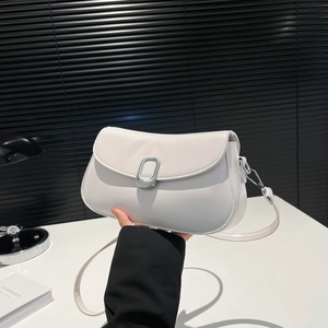 Modern white crossbody square bag with a prominent silver buckle on black background