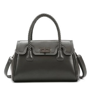 Dark grey leather shoulder bag with woven handle and metal clasp in a clean white background