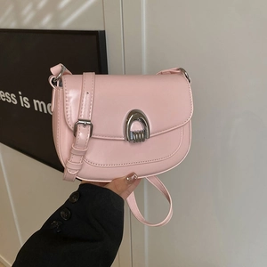 Minimalist light pink PU leather saddle bag with silver horseshoe buckle and shoulder strap