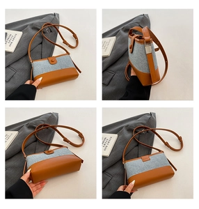 Detail view showing brown leather and grey textured fabric patchwork small square bag