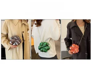 Mini flower shaped hard shell crossbody bag with metal chain in silver and orange