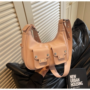Pink underarm bag with double front utility pockets and adjustable silver studded strap