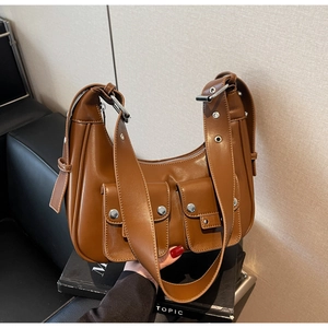 Brown vintage faux leather underarm bag with metal eyelet strap and double pockets