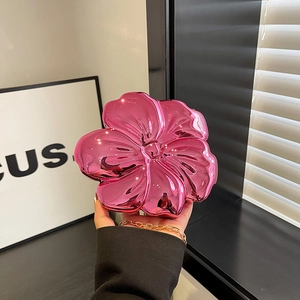 Pink metallic flower-shaped acrylic clutch bag with detachable gold chain strap