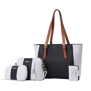 Ensemble de 4 sacs cabas contrastés en cuir noir et blanc avec des détails dorés