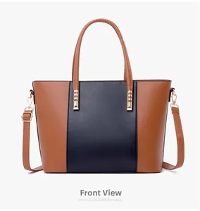 Vue de face du grand sac cabas bicolore marron et noir avec ferrures dorées