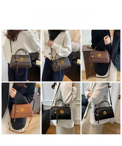 Detail showing vintage messenger bags in brown and black with gold locks and textures