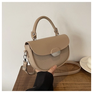 Beige patchwork saddle handbag with top handle and adjustable shoulder strap for women