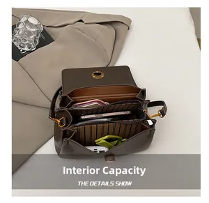 Detail view of the spacious inner compartments of this vintage brown leather messenger bag