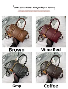Detail showing Boston handbags in brown, wine red, grey, and coffee with metal chain straps