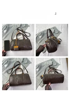 Four-angle view of vintage brown Boston bag with golden lock detail and detachable strap