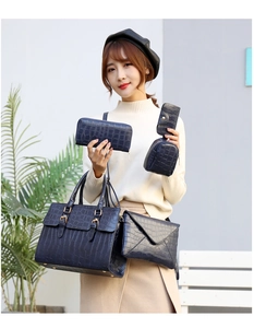Close-up of a 6-piece dark blue crocodile pattern handbag set for women with gold hardware