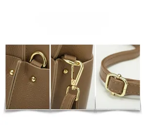 Detail of khaki pebbled leather bag featuring golden rivets, D-rings and sturdy lobster clasp