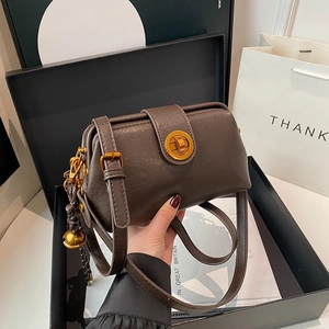 Vintage dark brown matte satchel with golden round lock and woven tassel detail