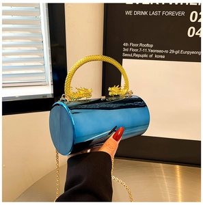 Detailed close-up of blue metallic acrylic cylinder evening bag with gold dragon handles