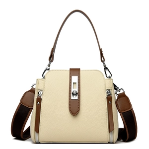 Retro bucket bag in off-white pebble leather with brown trim and wide shoulder strap
