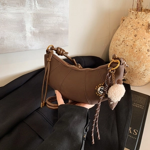 Retro dark brown crescent shoulder bag with knot strap and plush charm for women