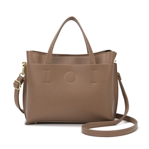 Brown textured leather tote bag with geometric stitching and golden metal hardware