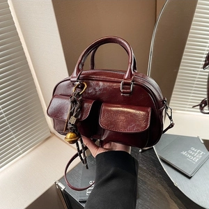 Retro deep red oil-wax leather large tote bag with dual front pockets and shoulder strap
