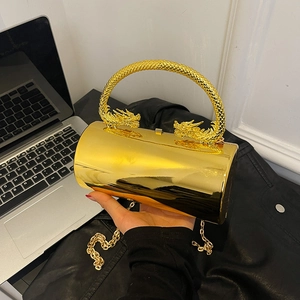 Luxurious gold cylindrical evening clutch bag with double dragon handles and chain strap
