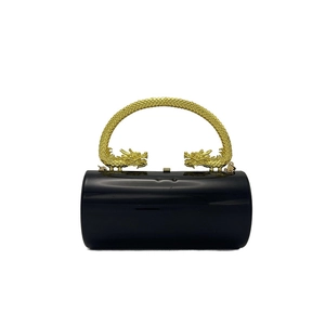 Elegant black acrylic cylindrical clutch bag with dragon-shaped gold metal handle for evening