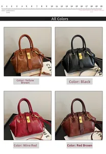 Detail view of four large textured faux-crocodile leather handbags with gold twist locks