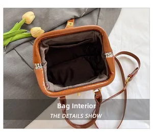 Interior view of caramel brown bag with dark lining and inner pocket detail